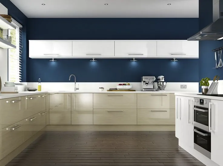 Spacious kitchen with glossy beige cabinets and a deep blue accent wall