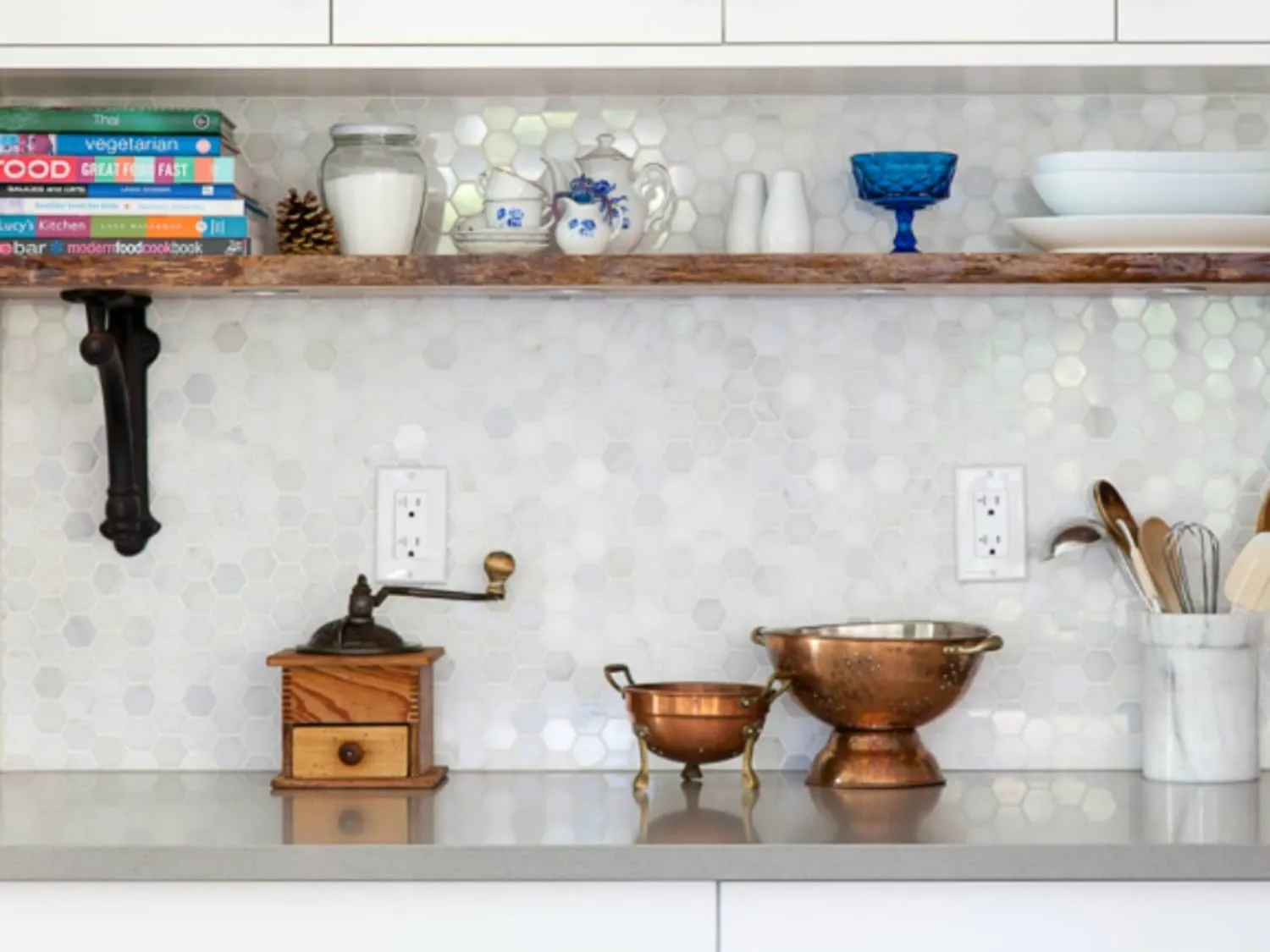 Wooden shelf in kitchen holding cookbooks and vintage kitchen items Wooden shelf in kitchen holding cookbooks and vintage kitchen items