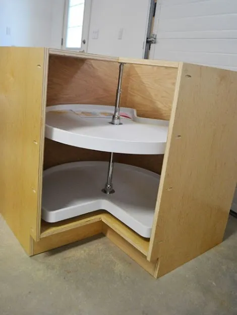D Shaped Pie Cut Corner Cabinets base pie cut corner kitchen cabinet in a white kitchen