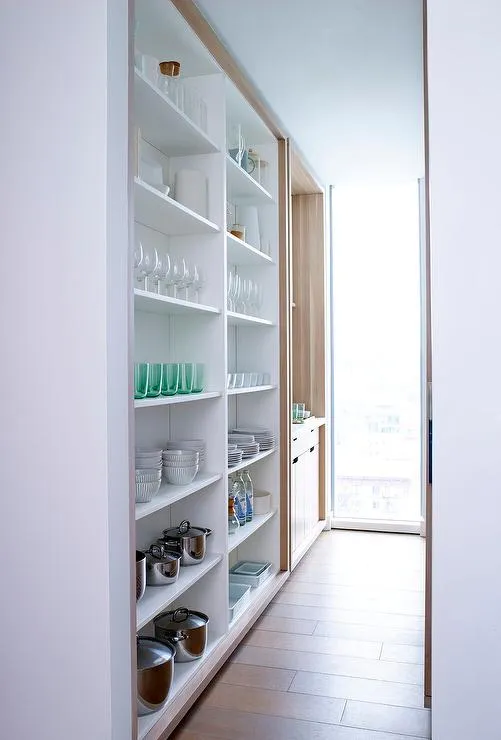 open kitchen cabinets with floor to ceiling shelving