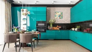 Bright teal kitchen cabinets with matching dining chairs