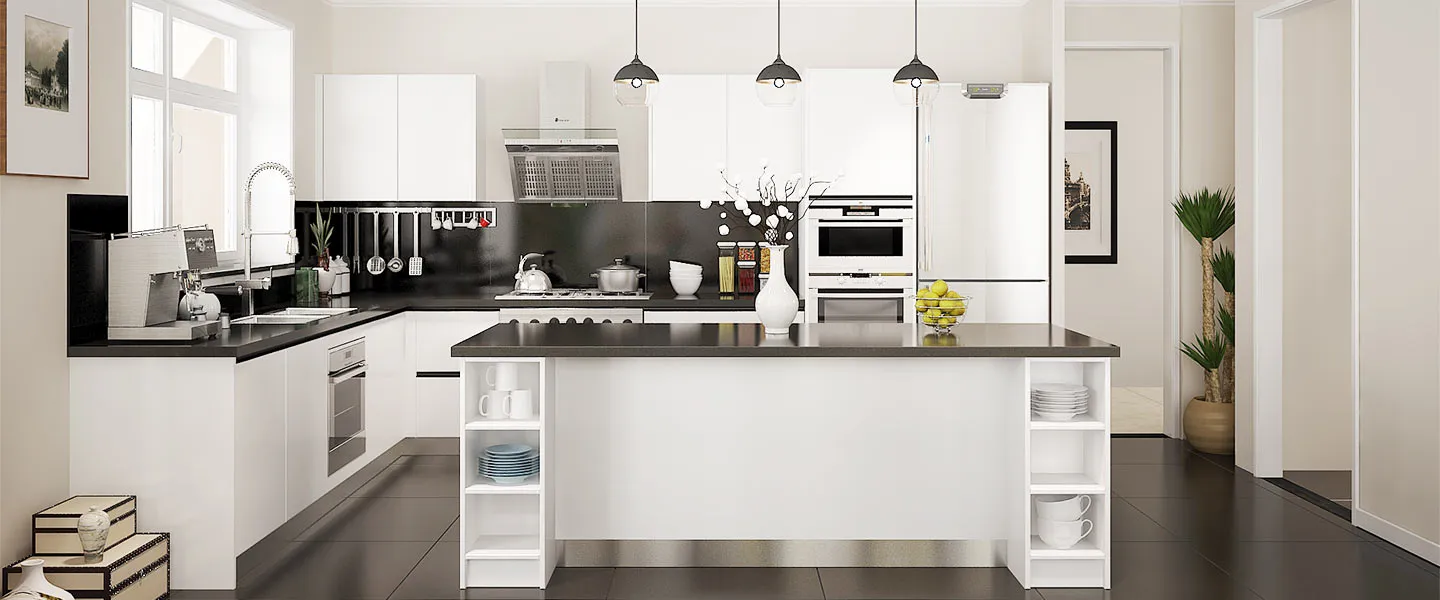 Bright white kitchen with black countertops and integrated shelving