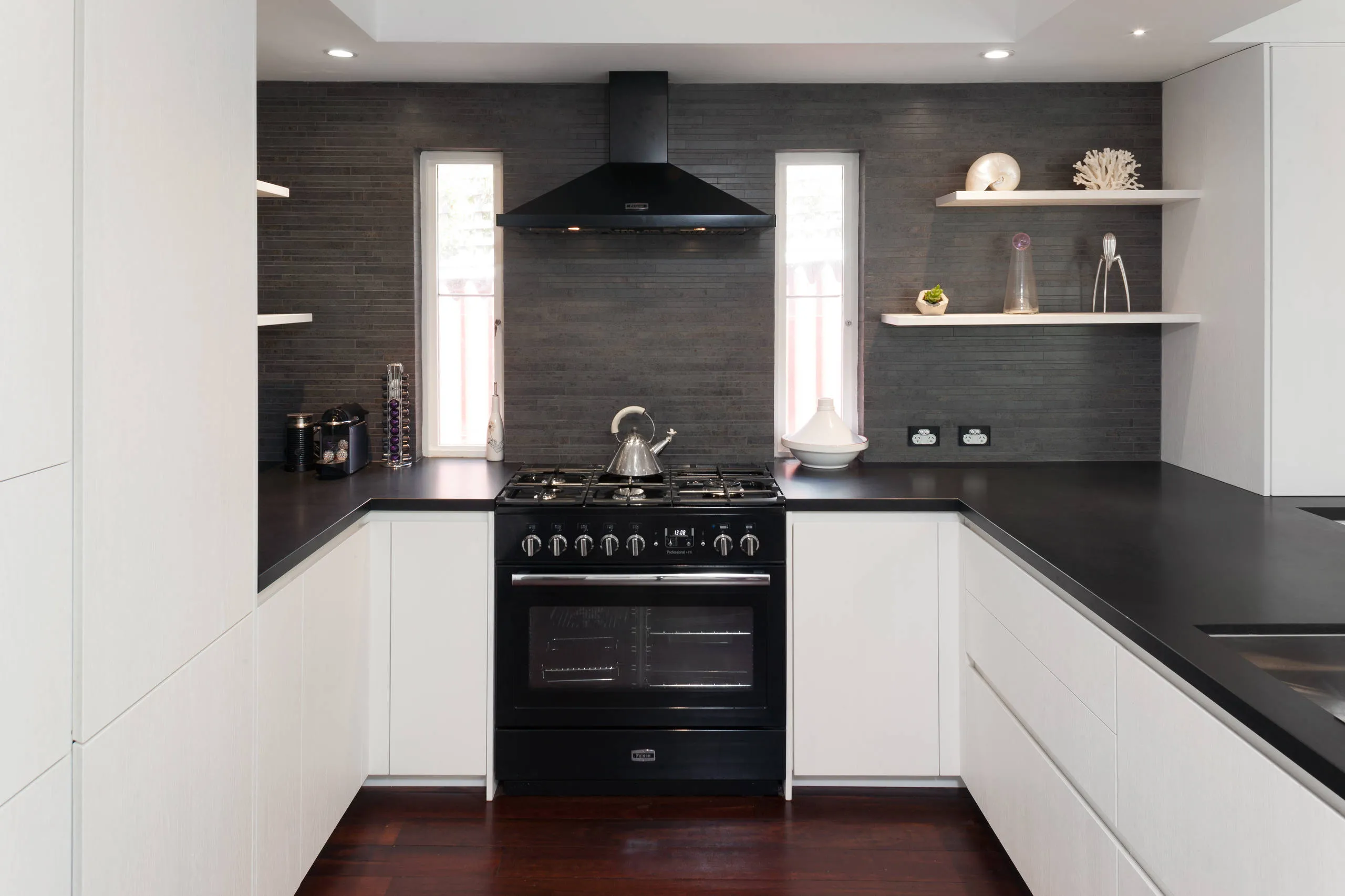 Small black kitchen with marble countertops and open shelves Modern Black and White Cabinets Baking Station