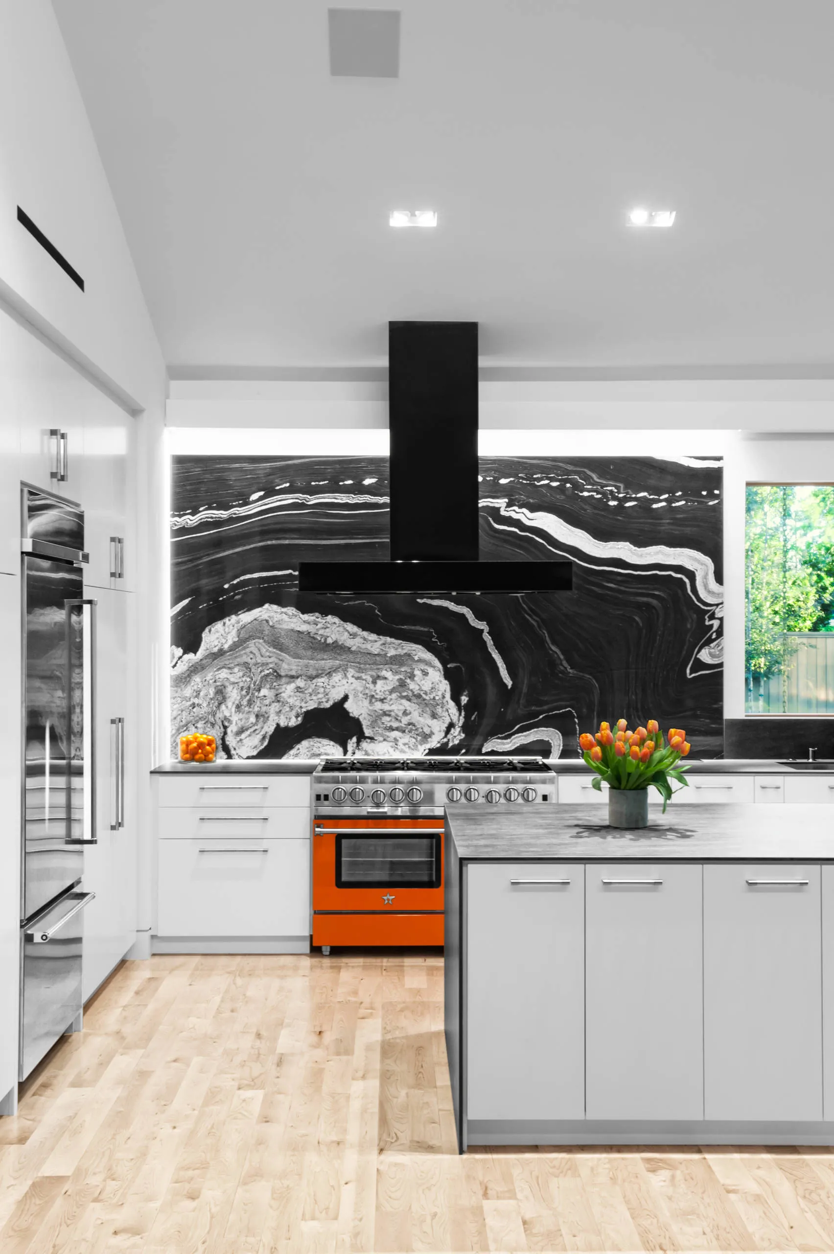 White kitchen cabinets with a blue patterned backsplash Modern Black and White Cabinets Colored Backsplash