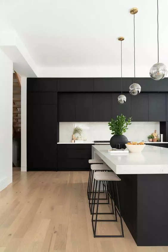 Sleek black kitchen cabinets with modern appliances and bar stools Modern Black and White Cabinets Lighting Fixtures