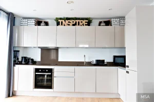 Stylish decor above modern kitchen cabinets for a sleek look