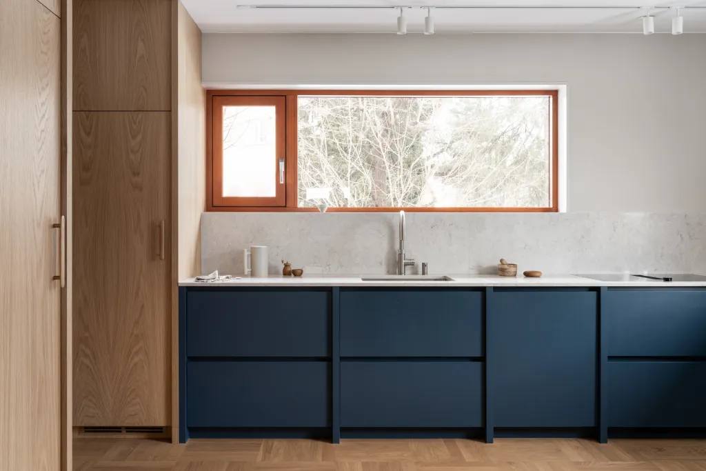 Two tone kitchen with light blue cabinets and wooden countertops modern blue Kitchen Cabinets Blue with Warm Wood Accents