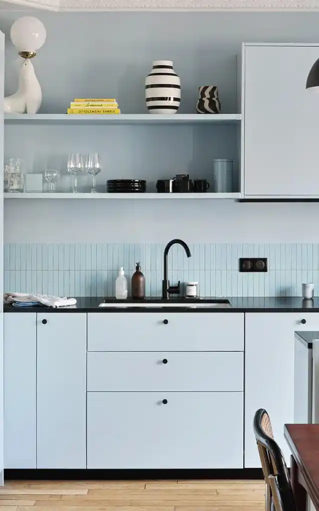 Bright kitchen with light wood cabinets and built in breakfast nook wood kitchen cabinet Light Blues wall
