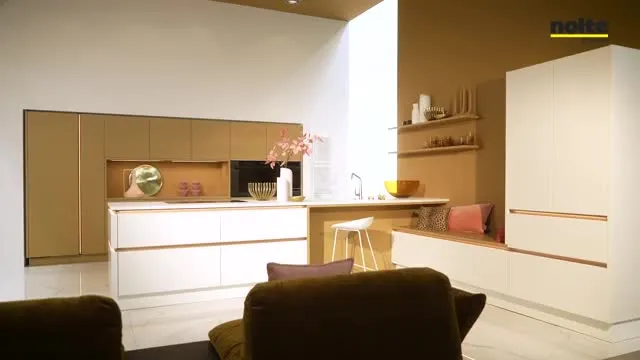 Wooden cabinets with dual wall oven and warm orange accent wall wood kitchen cabinet Soft Caramel wall