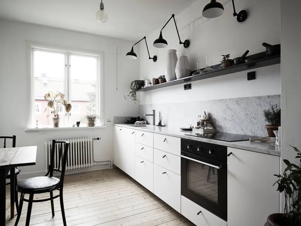 Clean white kitchen design with black hardware for contrast
