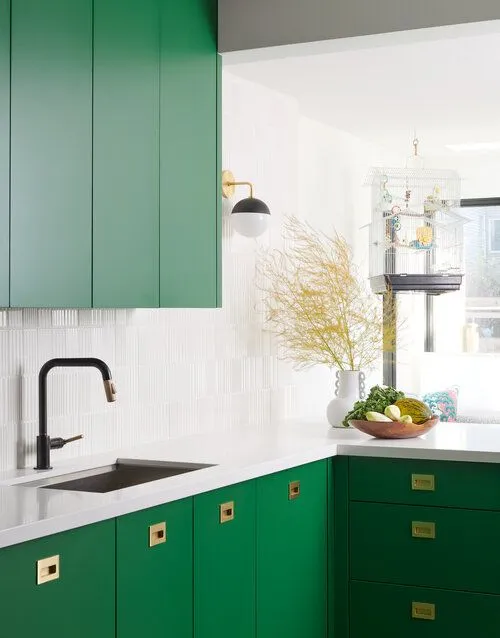 Contemporary kitchen featuring green walls and dark cabinets Contemporary kitchen featuring green walls and dark cabinets