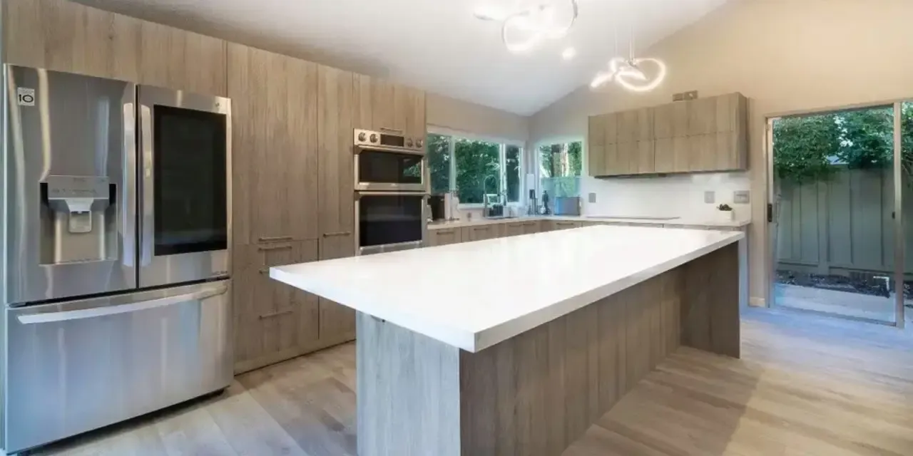 Modern taupe kitchen cabinet with sleek design and handles Modern taupe kitchen cabinet with sleek design and handles