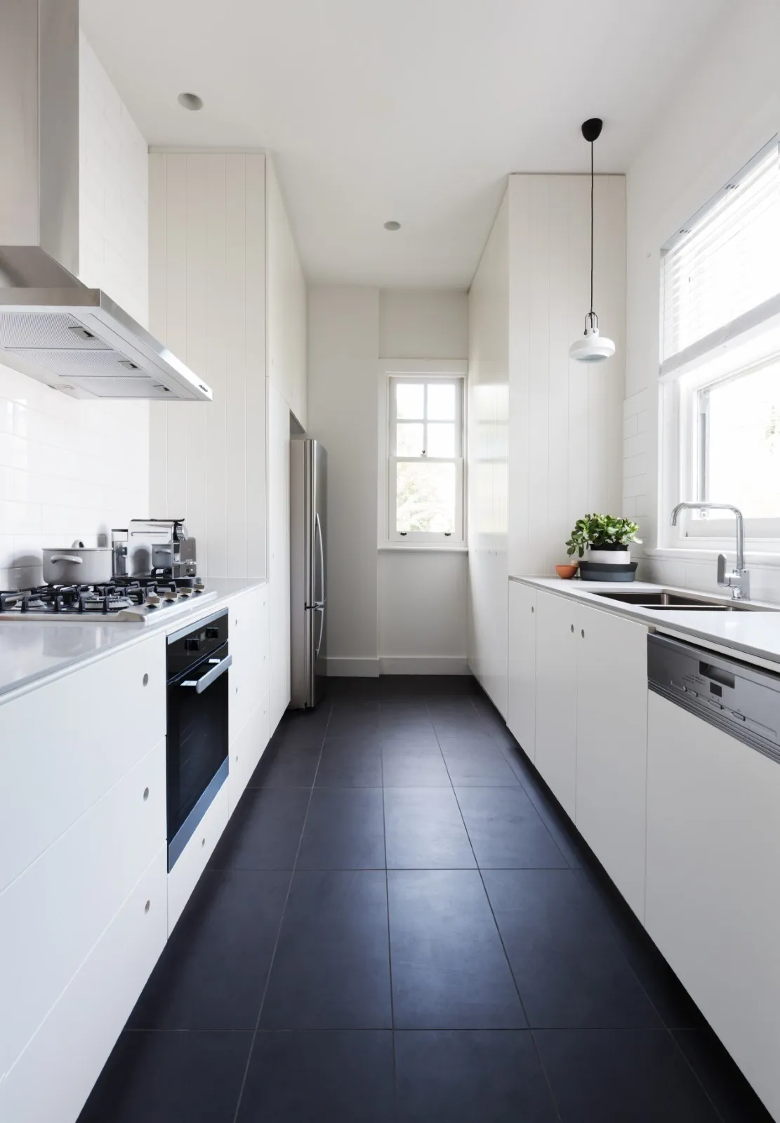 modern White kitchen cabinets with black hardware Galley Kitchens