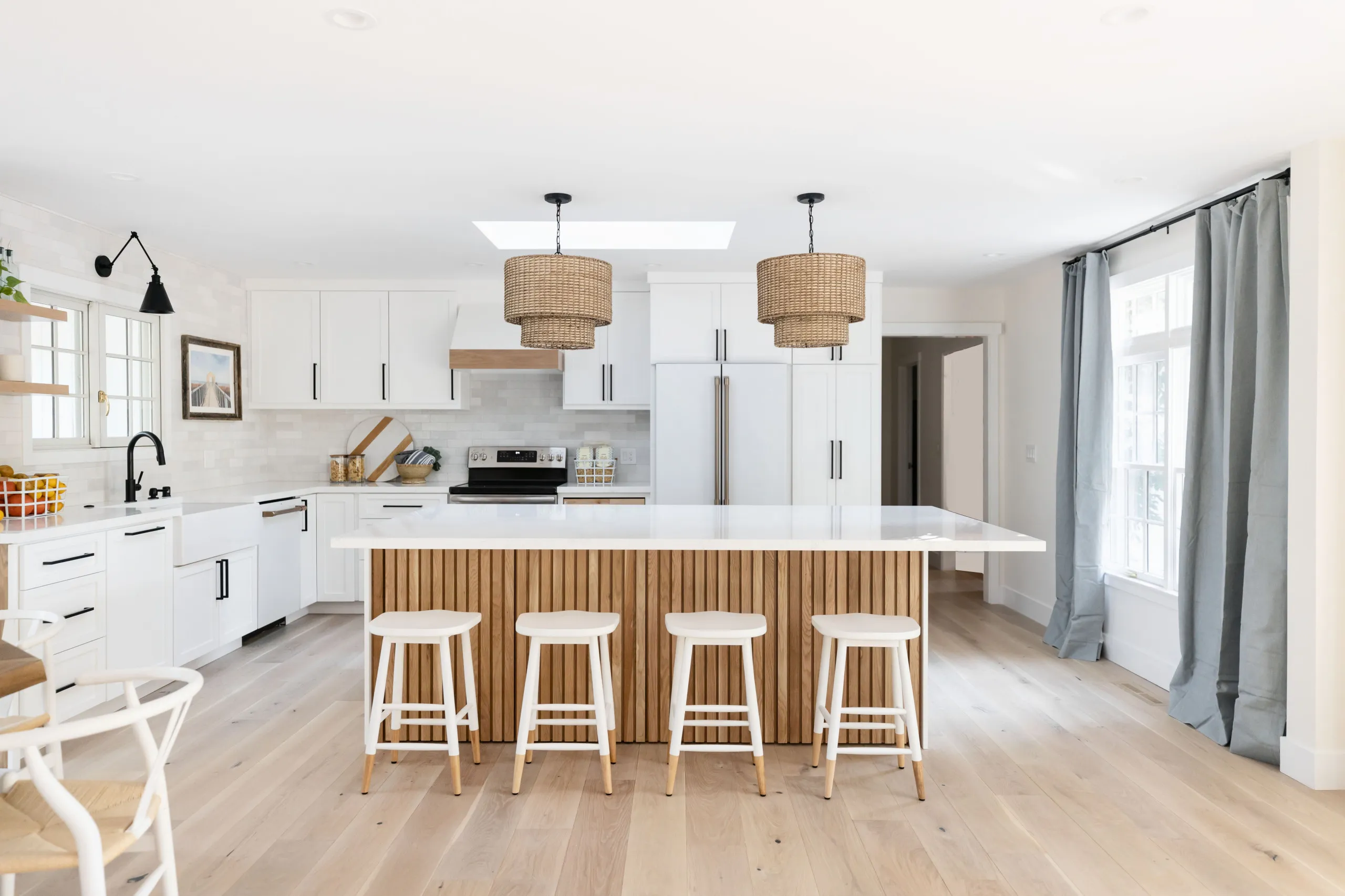 modern White kitchen cabinets with black hardware Open Concept Layouts
