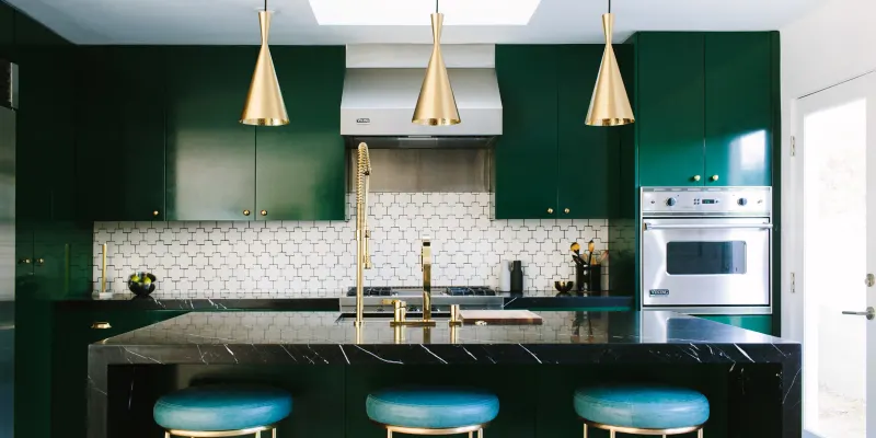 Use Marble Accents Dark green kitchen cabinets with brass hardware and marble shelf modern green kitchens with dark cabinets Use Marble Accents