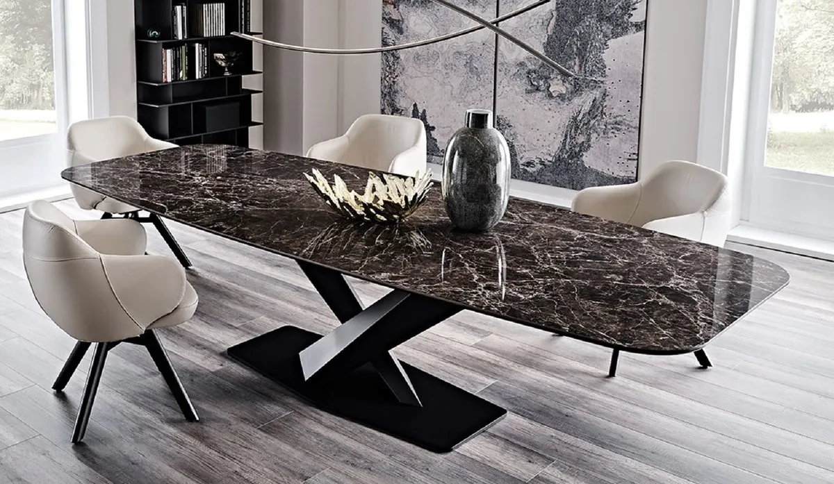 Modern dining table with dark marble top and beige chairs Modern dining table with dark marble top and beige chairs