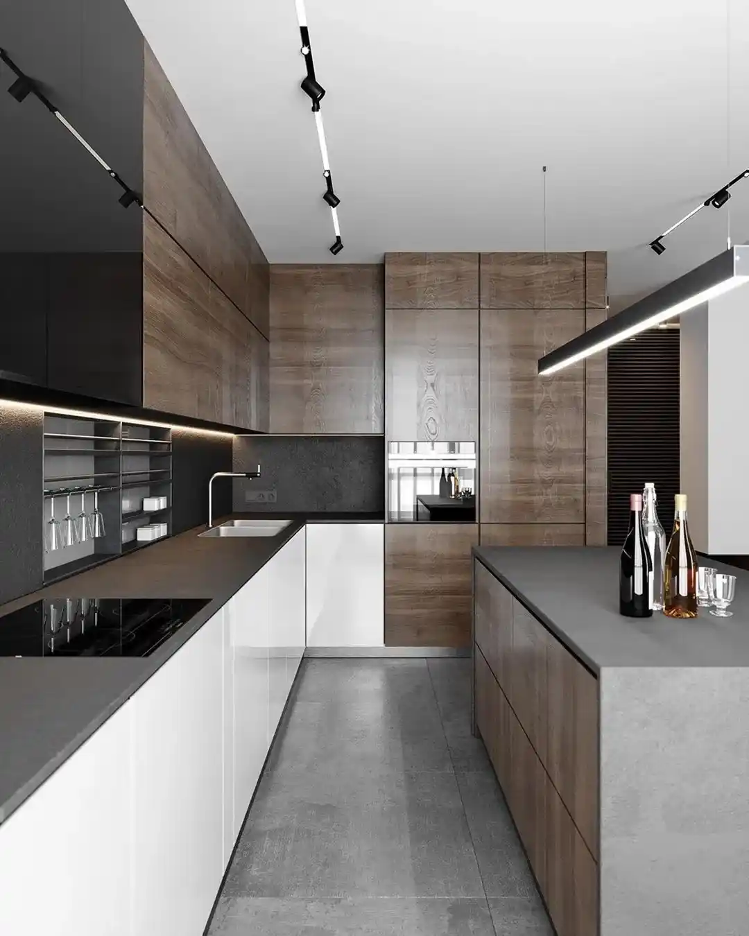 Modern taupe kitchen with sleek cabinets dark countertops and integrated lighting Modern taupe kitchen with sleek cabinets dark countertops and integrated lighting