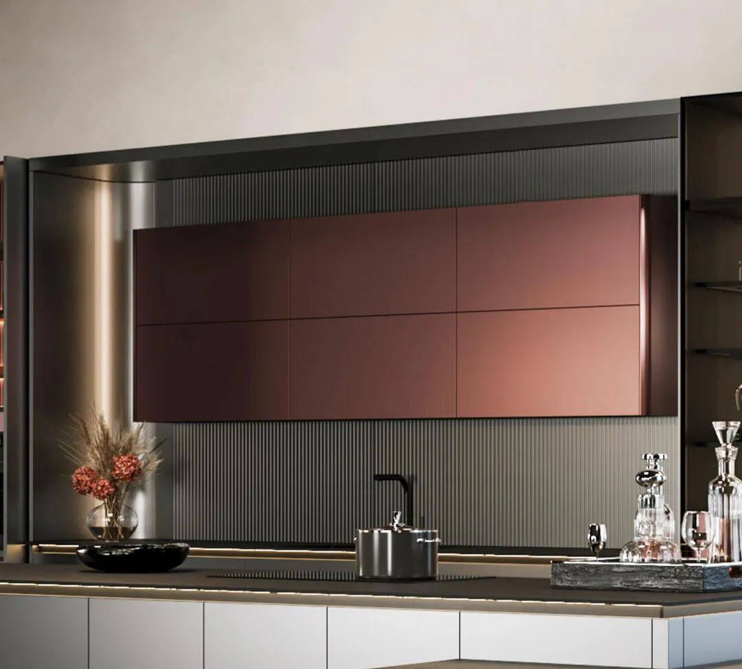 Sleek kitchen with metallic rose cabinets and minimalist decor