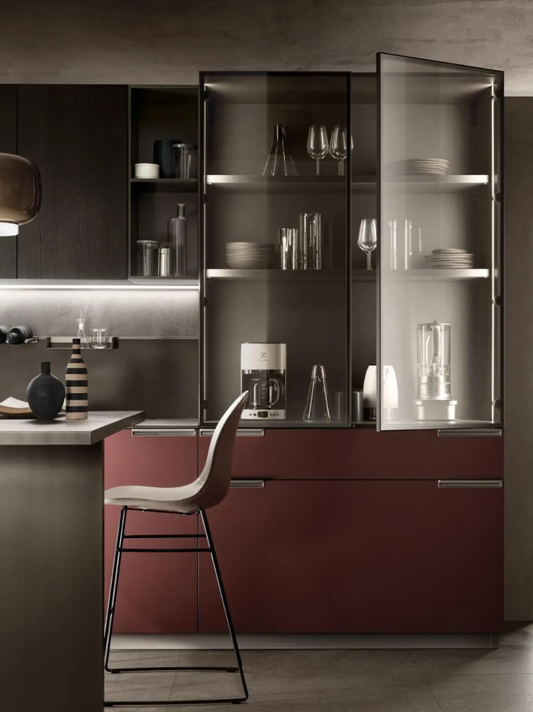 Sophisticated kitchen with red cabinets and glass display shelves