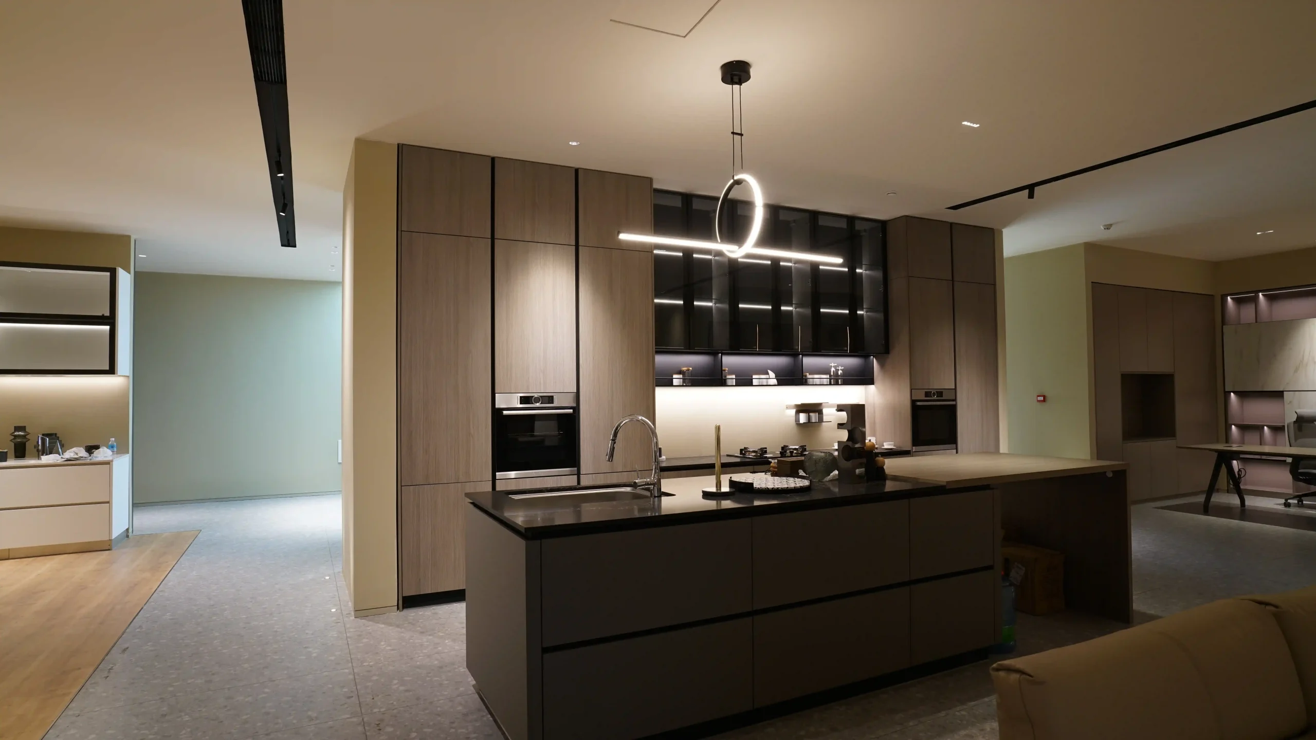 Spacious modern kitchen with island and chic pendant lighting Spacious modern kitchen with island and chic pendant lighting