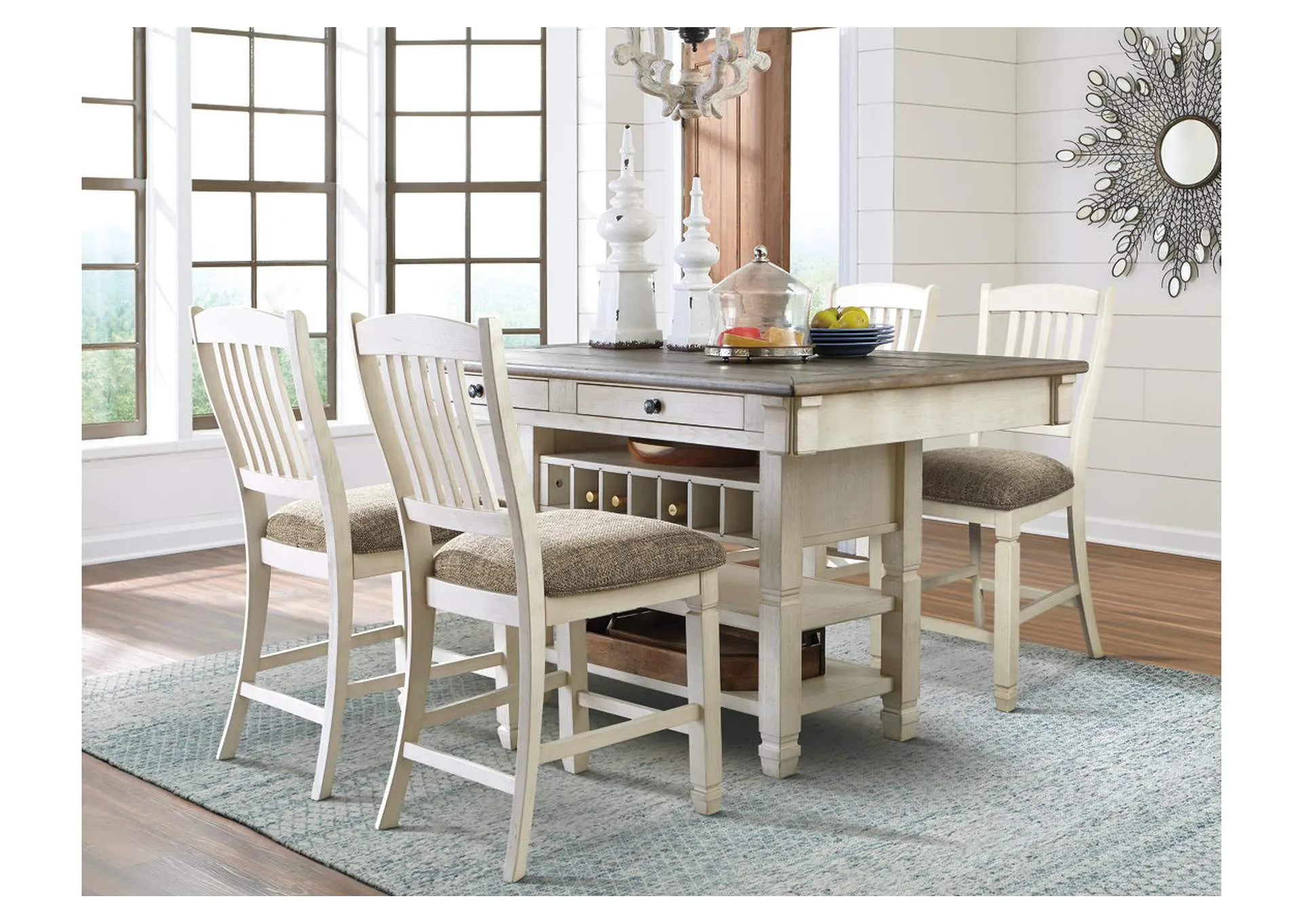 Counter height dining table with matching chairs and decor