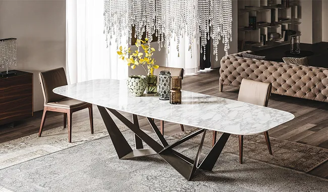 Elegant marble dining table with unique metal base and chairs Elegant marble dining table with unique metal base and chairs
