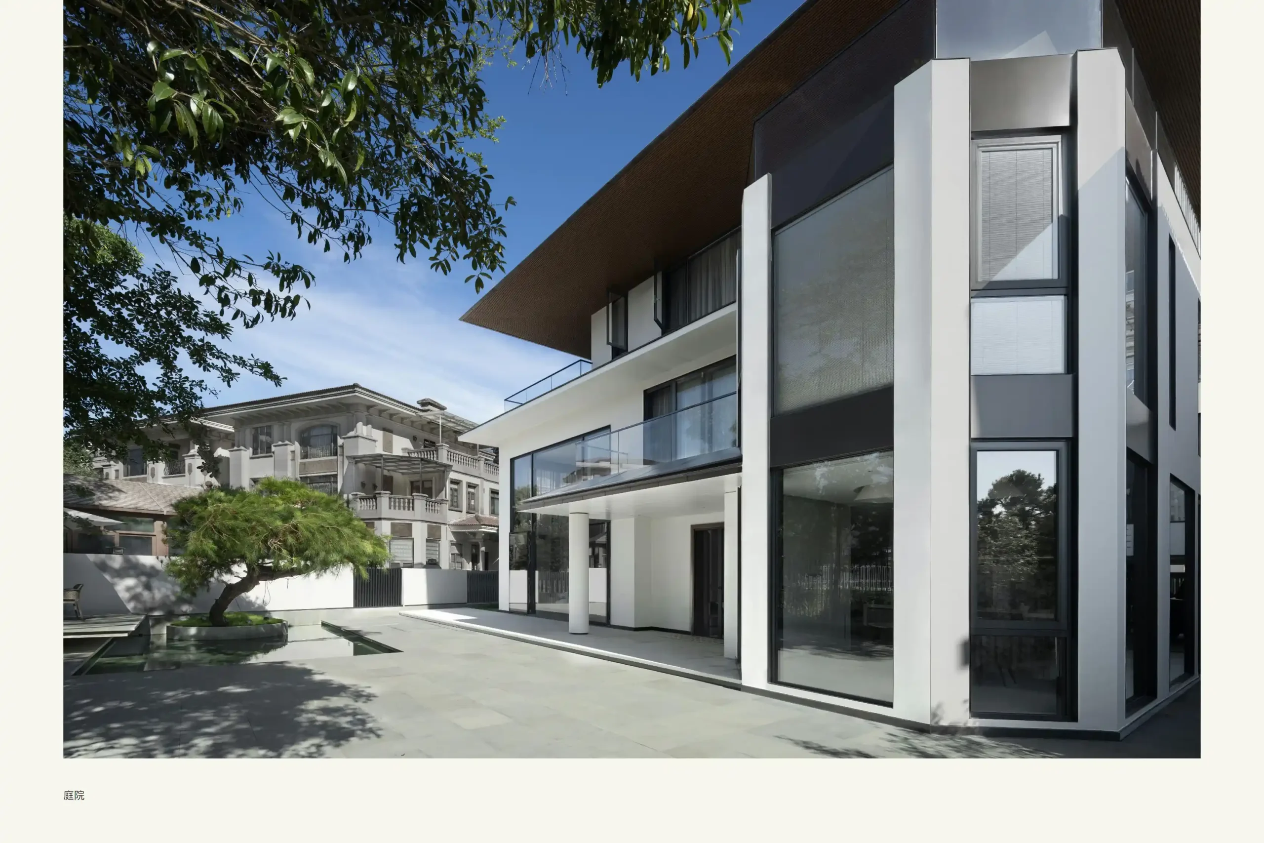 Indonesia Apartment Modern house exterior with tree and clear blue sky