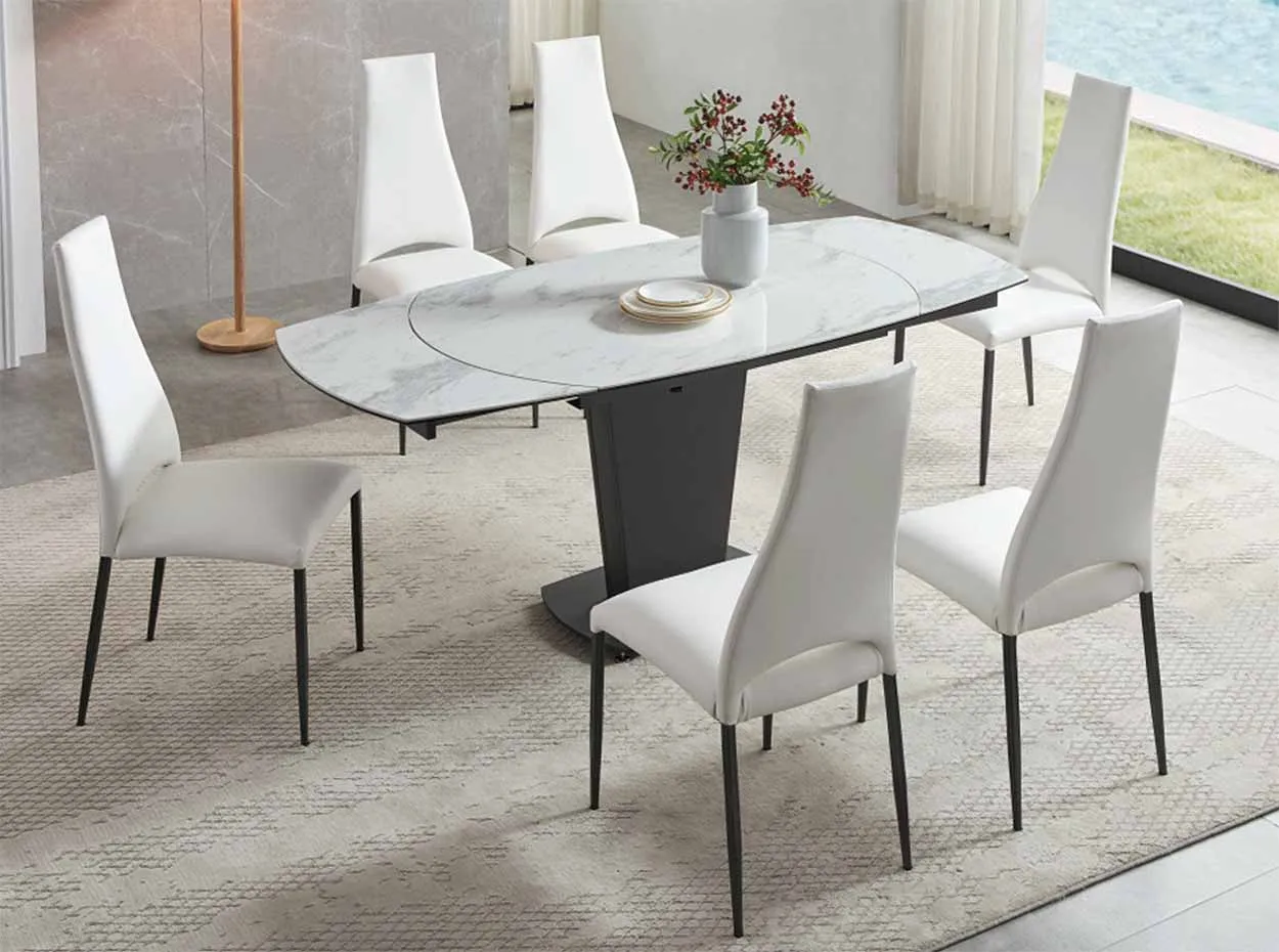 Modern ceramic dining table with white chairs and decor Modern ceramic dining table with white chairs and decor