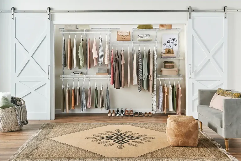 Stylish closet with wire shelving holding neatly hung clothes