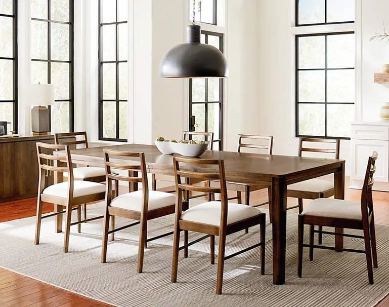 Wooden dining table with six chairs and a leather bench