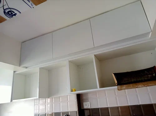 Installing upper wood frame above cabinet