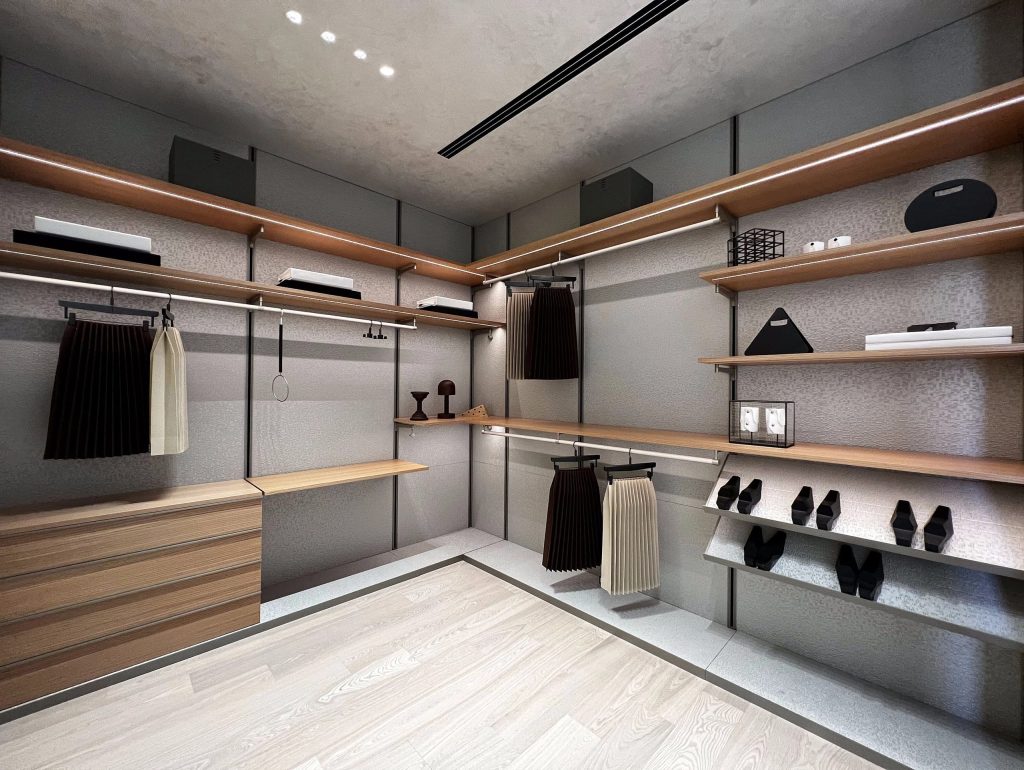 Wide view of modern walk-in wardrobe with lighting