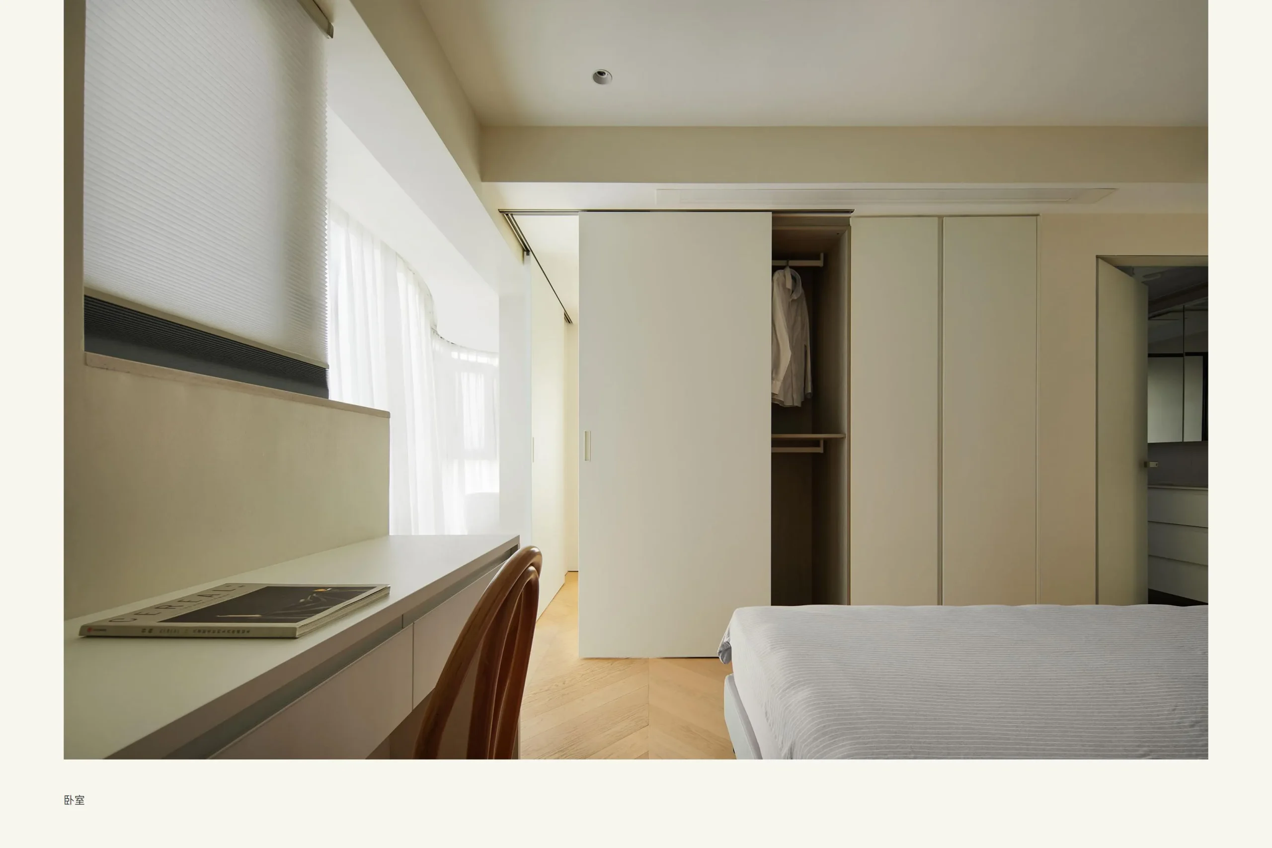 Minimal bedroom with sliding wardrobe
