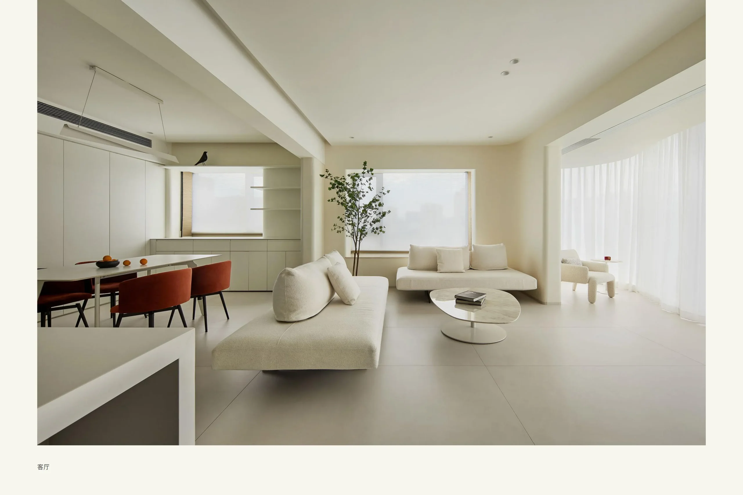 Minimalist living room with white sofa and chairs