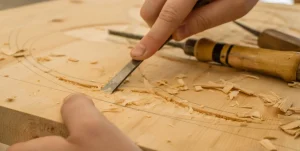 Wood carving in progress on a solid wood board