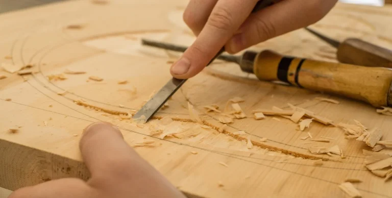 Wood carving in progress on a solid wood board