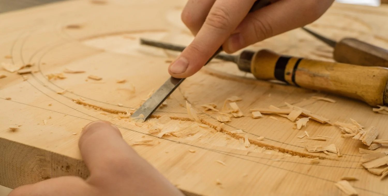 Wood carving in progress on a solid wood board