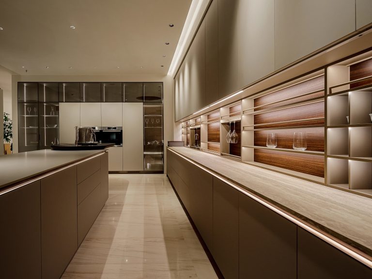 Minimalist Kitchen Cabinet with light-toned cabinets and wooden details.