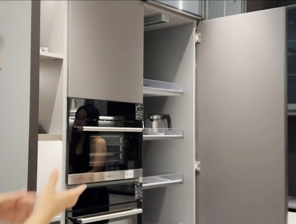 Italian Kitchen Cabinet with built-in oven and shelving.
