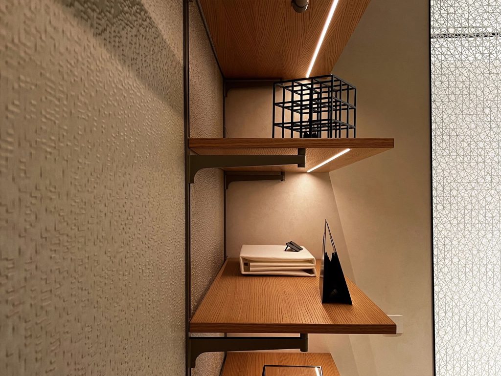Minimalist walk-in wardrobe with warm wood tones