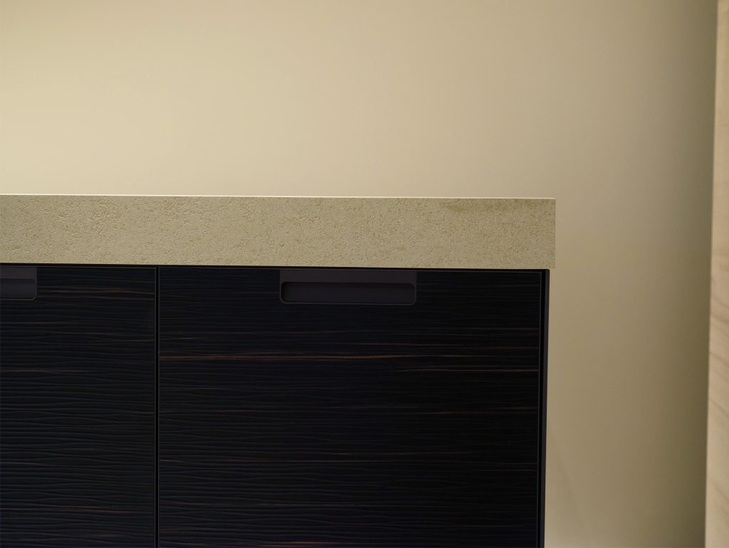 European kitchen cabinet with minimalist style and gold faucet.